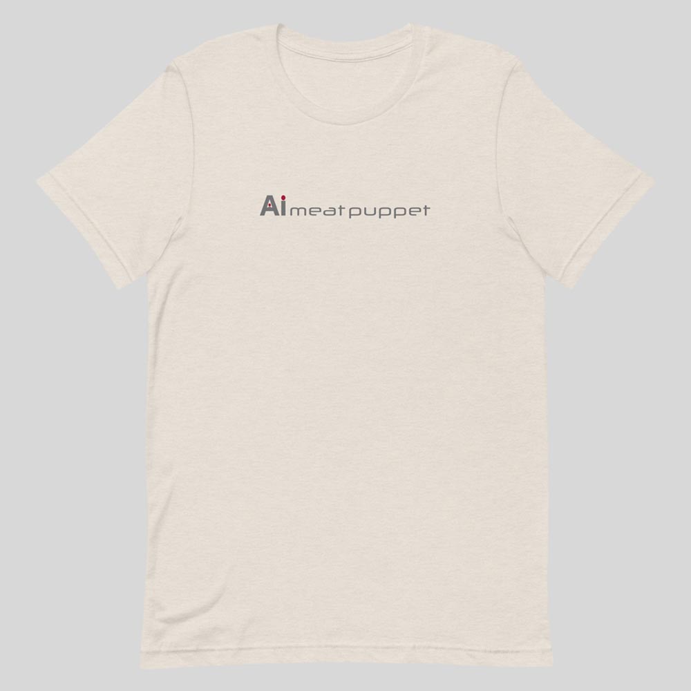 The front of an off-white AI Meat Puppet T-shirt with the AI Meat Puppet logo on it against a light grey background