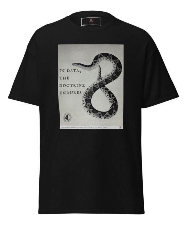The front of a black AI Meat Puppet t-shirt with a muted monochrome image which integrates symbolic serpentine geometry with doctrinal text, that reads “In data, the doctrine endures”.