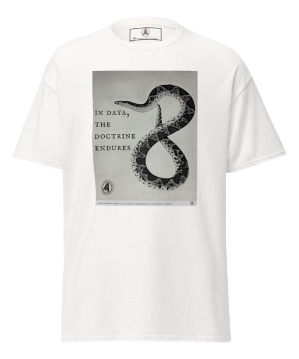 The front of a white AI Meat Puppet t-shirt with a muted monochrome image which integrates symbolic serpentine geometry with doctrinal text, that reads “In data, the doctrine endures”.